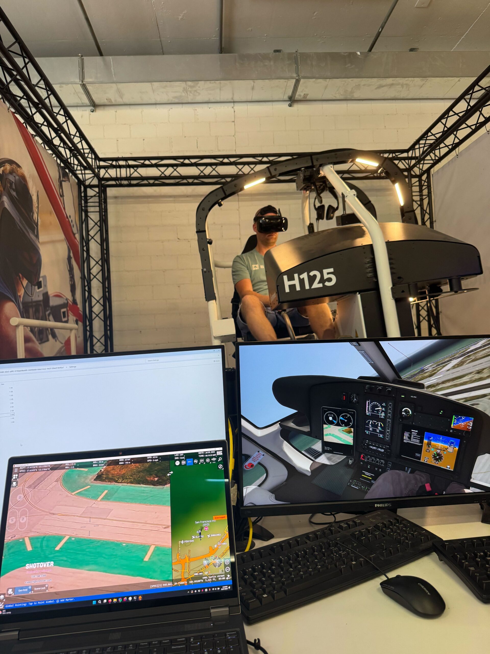 SHOTOVER simulator workstation and displays connected with an H125 virtual reality helicopter training setup